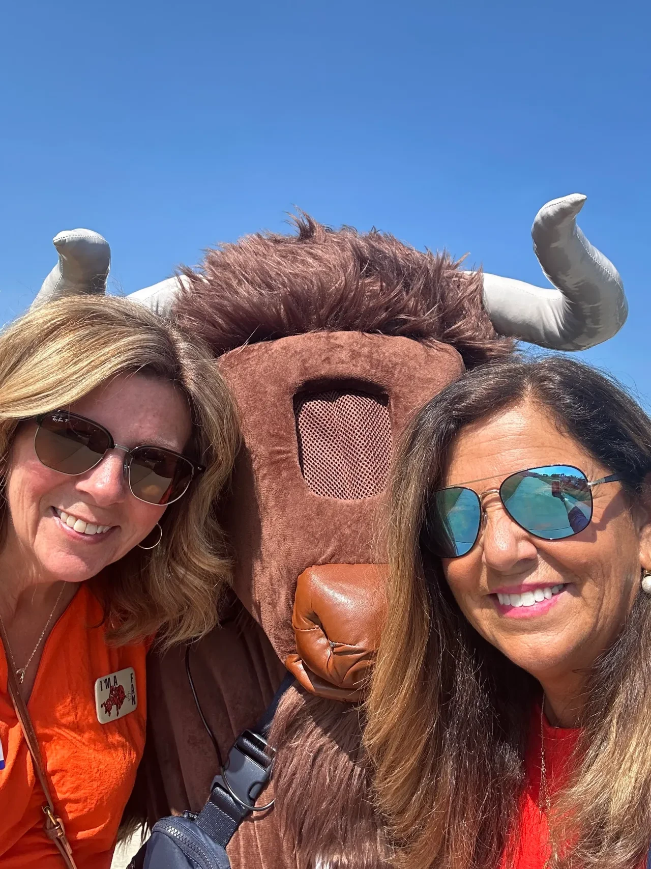 Alumni posing with the Bison mascot at the golf outing