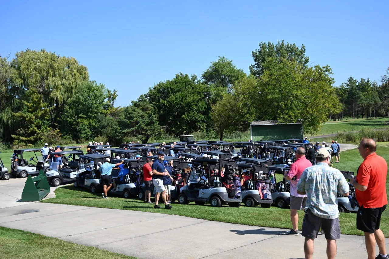Rows of golf carts lined up before the shotgun start