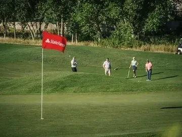 Golf pin flag on green