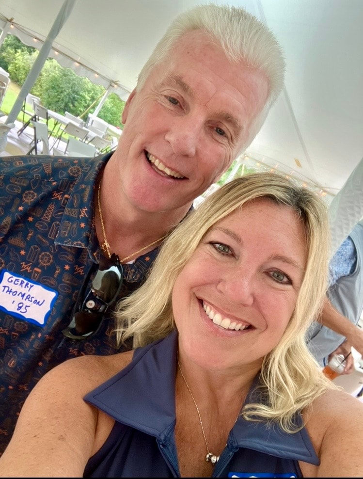 Two people smiling at outdoor event