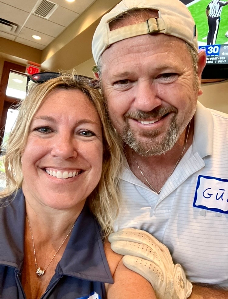 Couple smiling at indoor event together