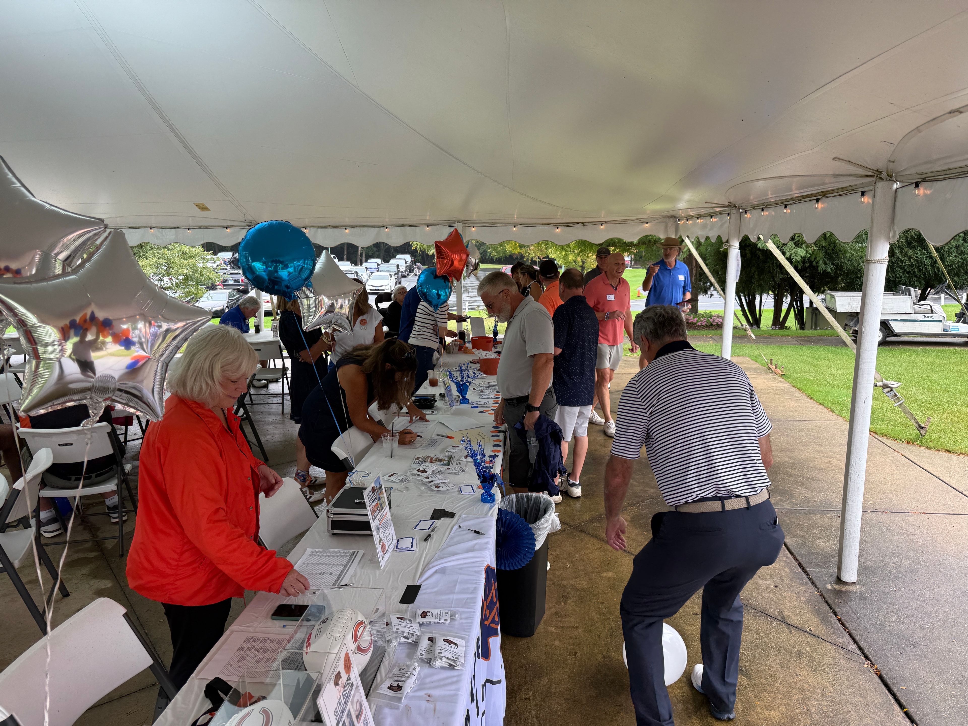Outdoor community event under tent