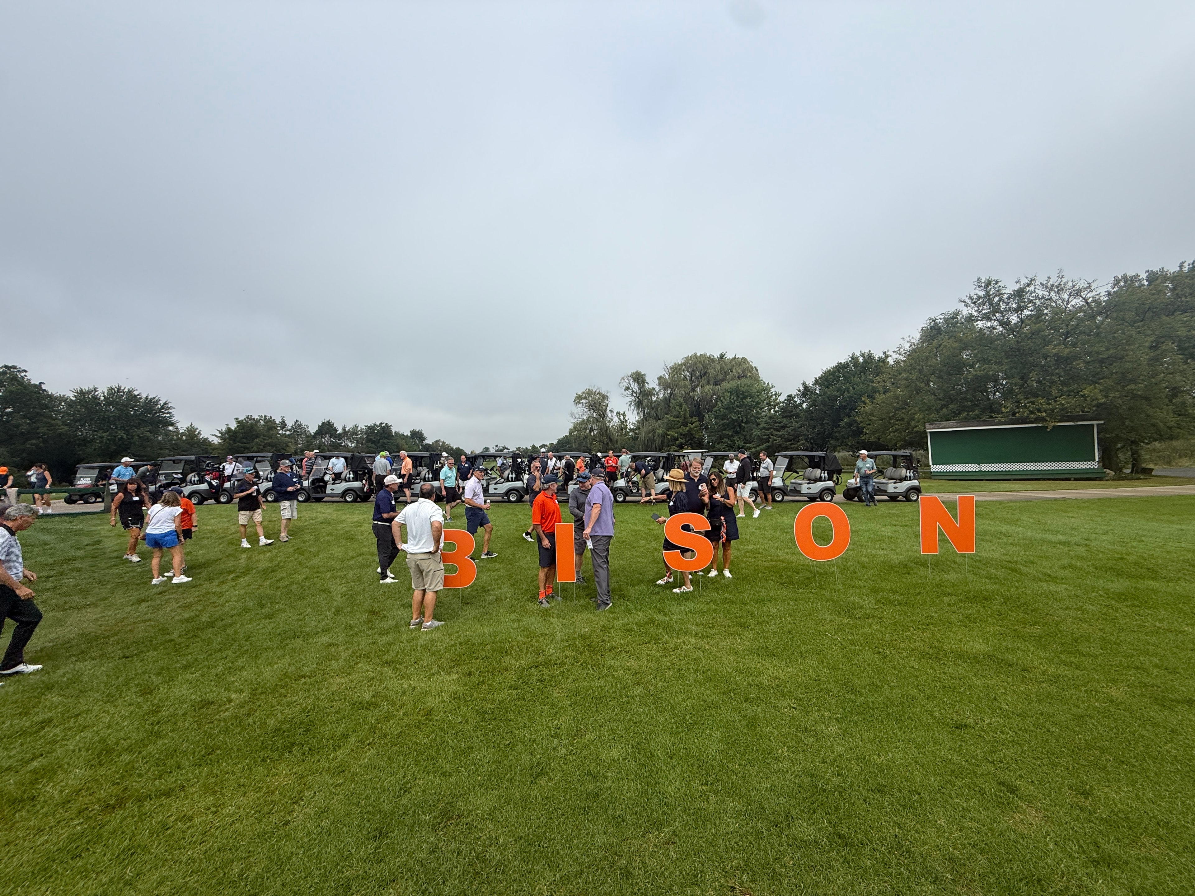Community gathering at the course