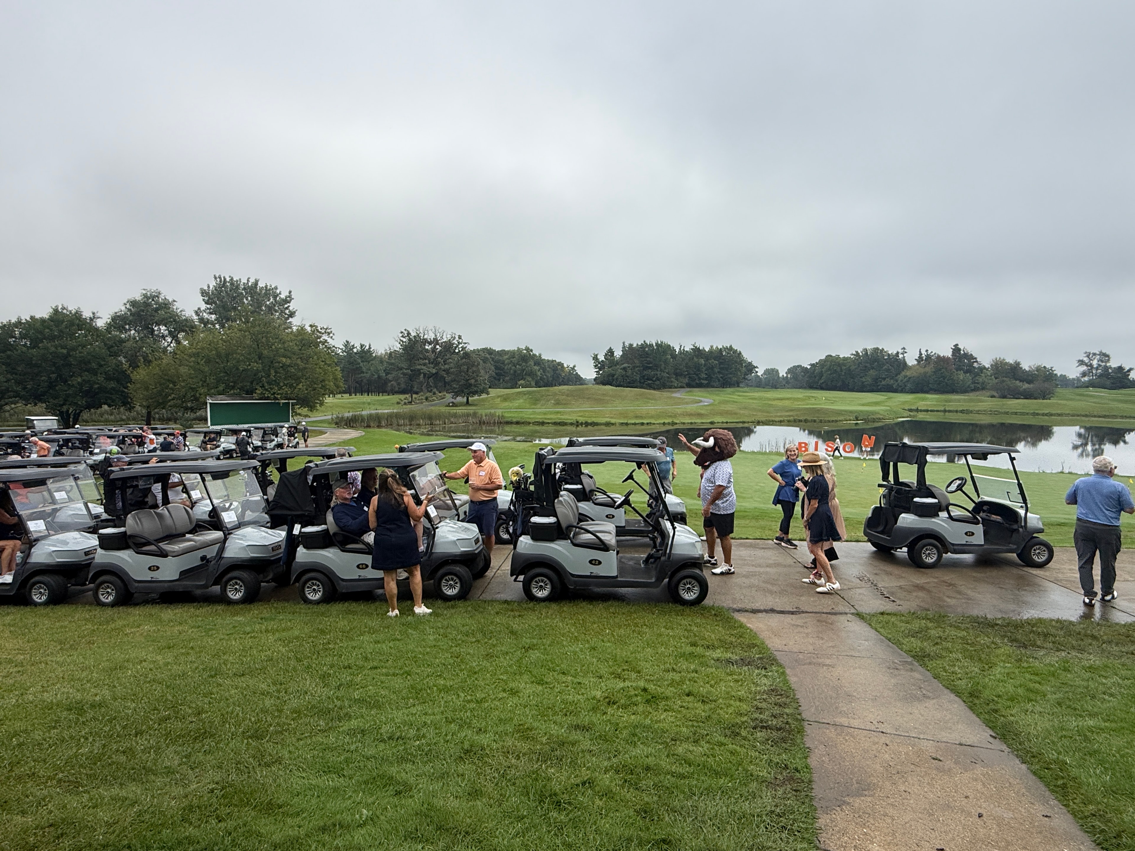 Golf carts lined up at course event
