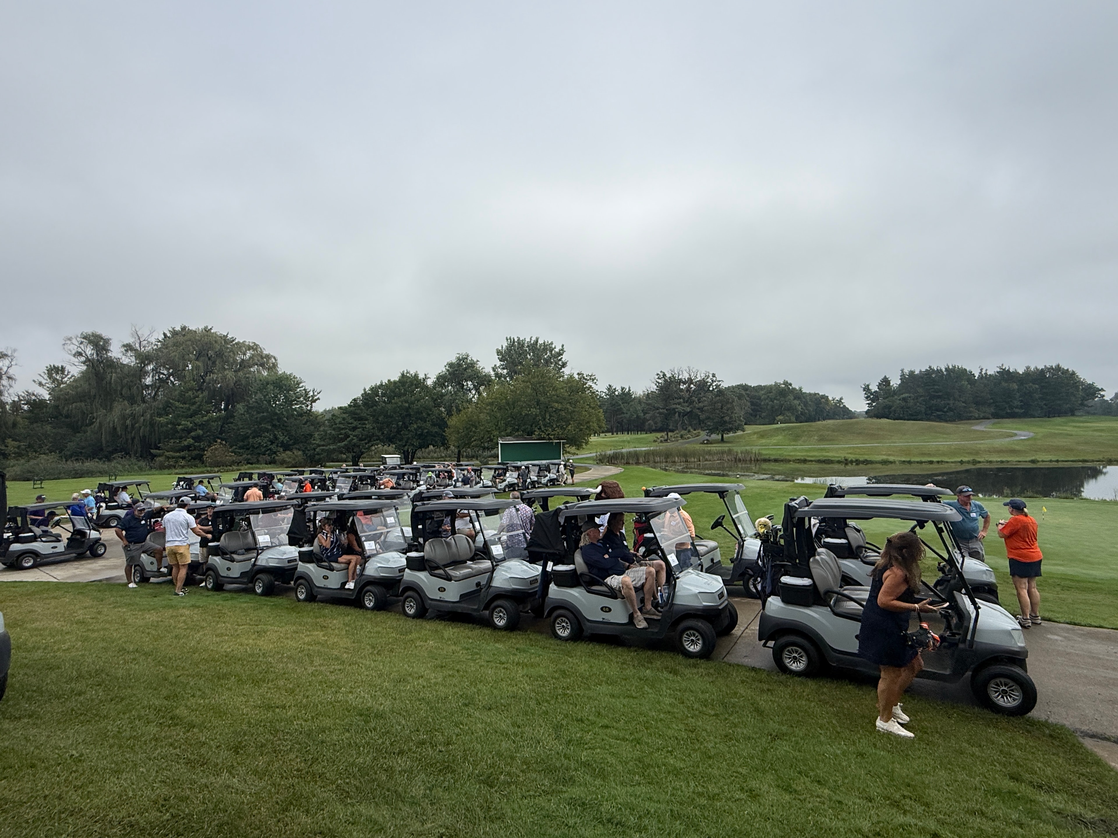 Golf carts lined up at tournament