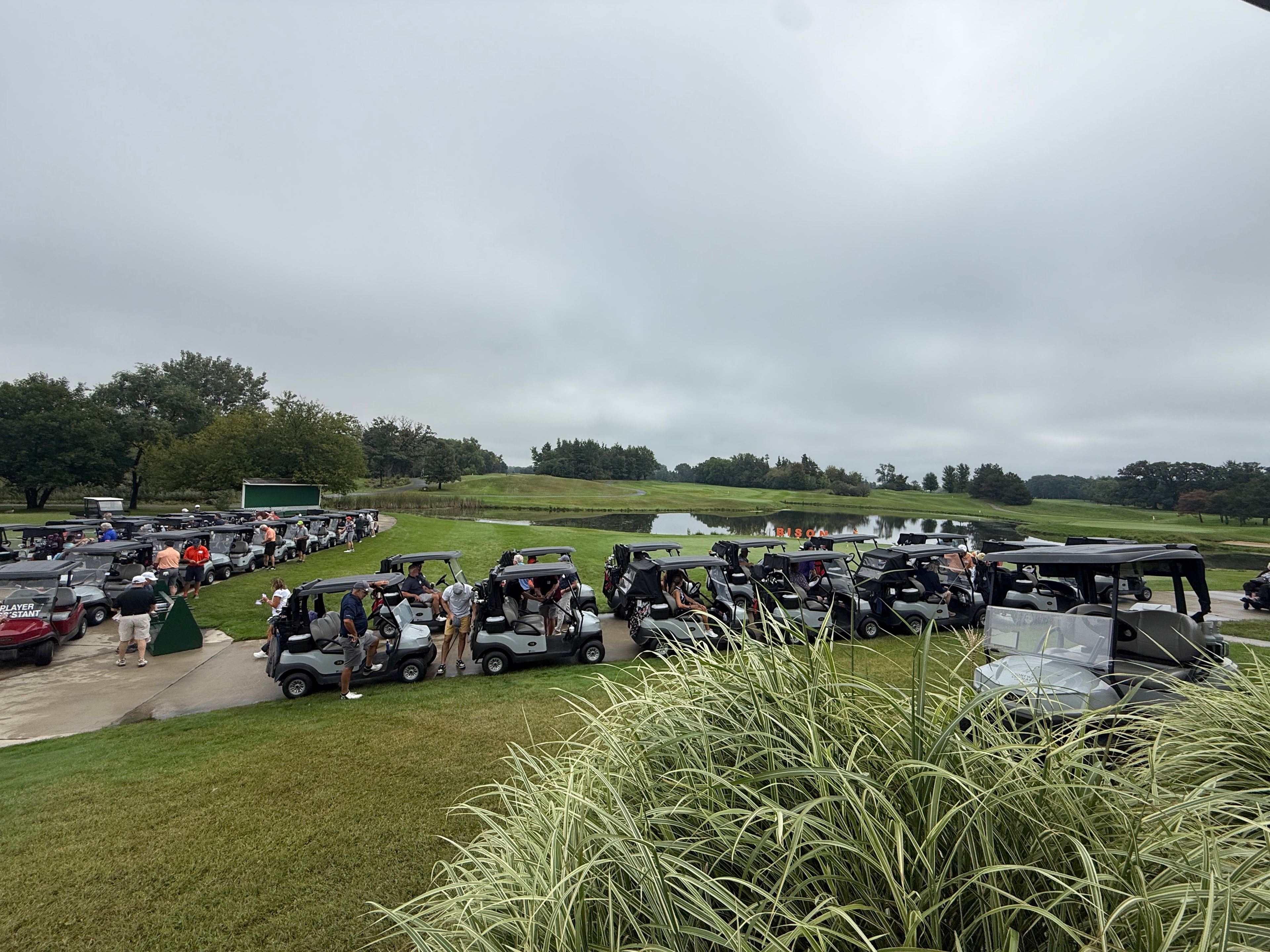 Golf tournament gathering with carts