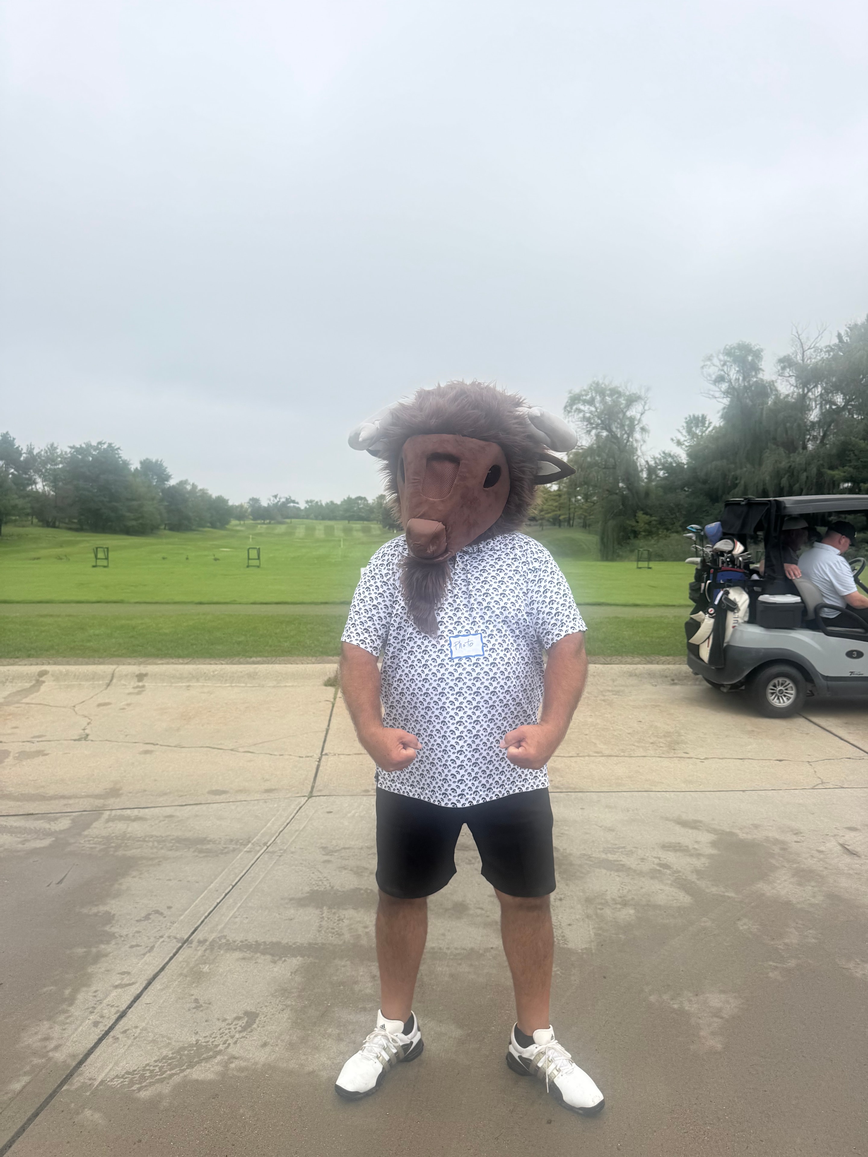 Person wearing Bison mascot at golf course