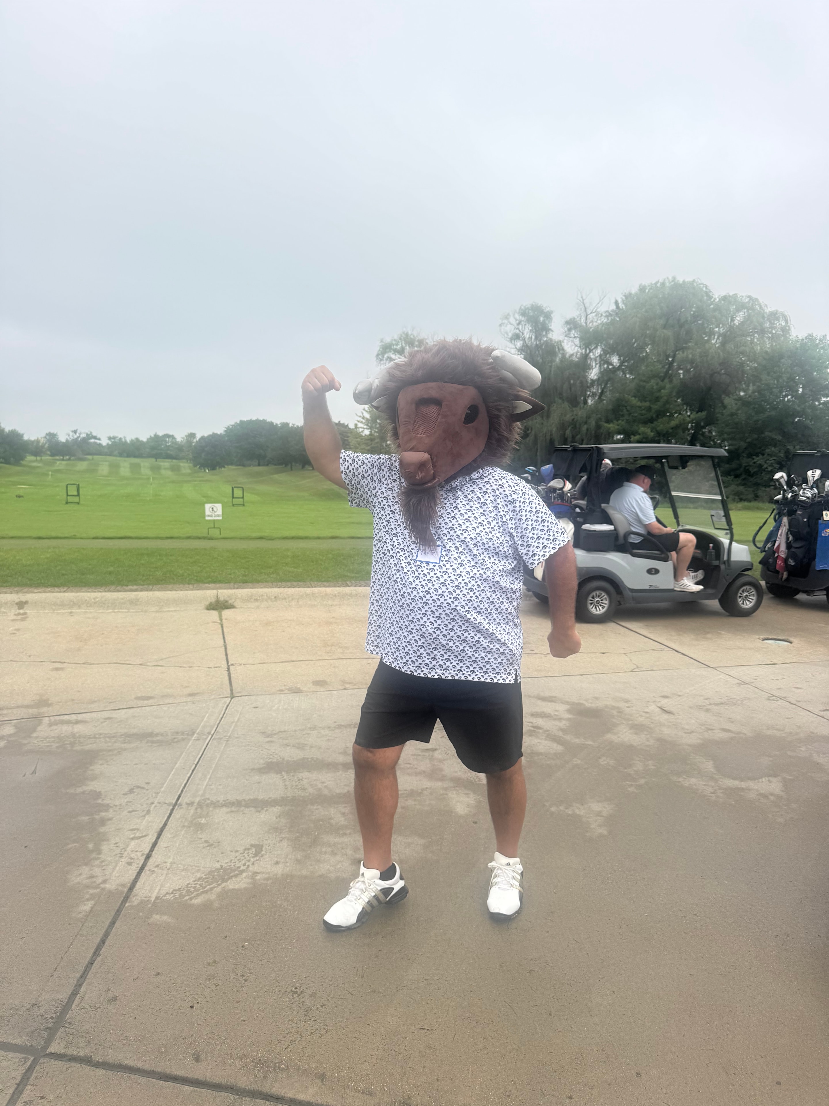 Person in Bison mascot costume at course