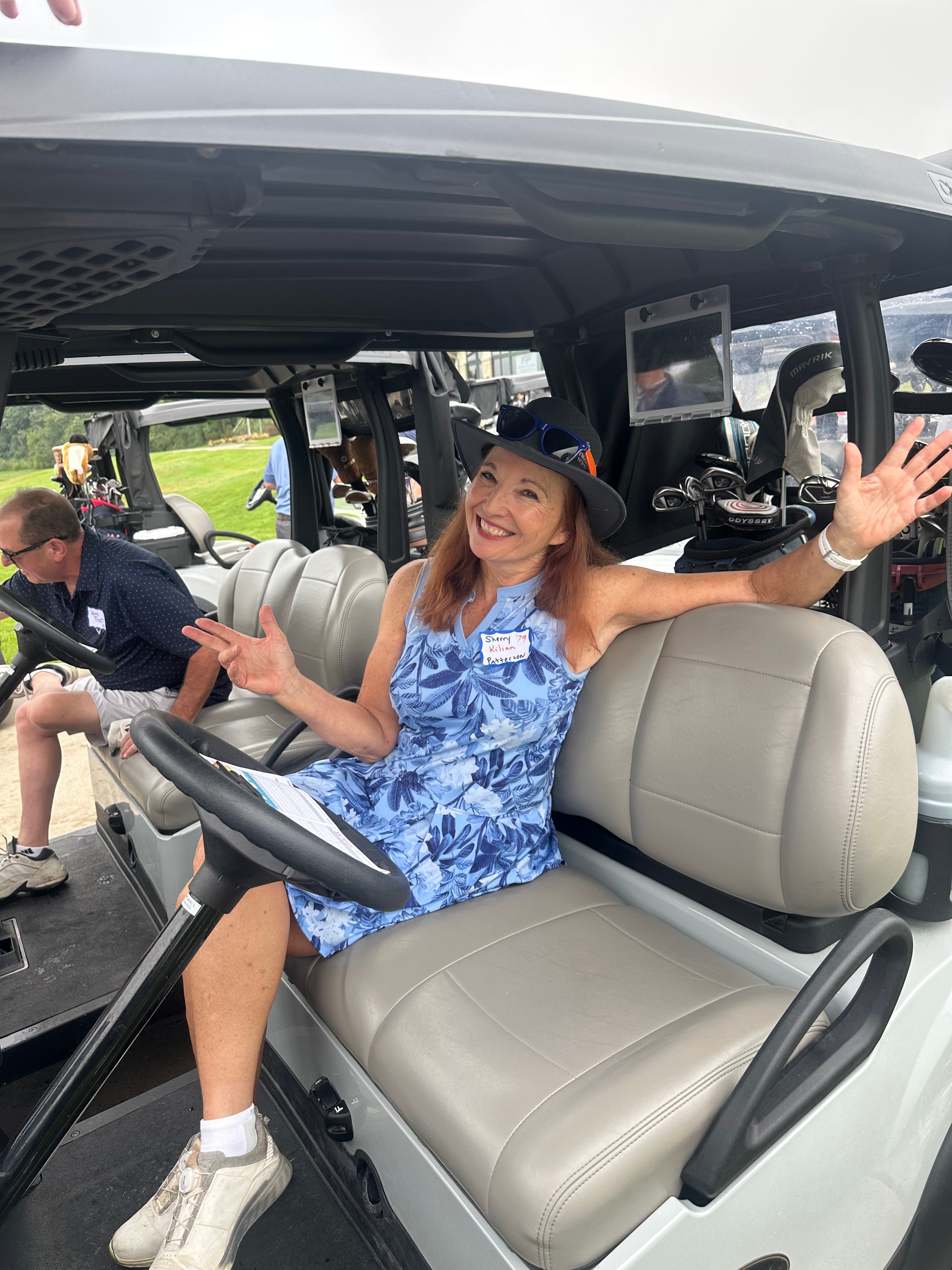 Woman smiling in open jeep vehicle