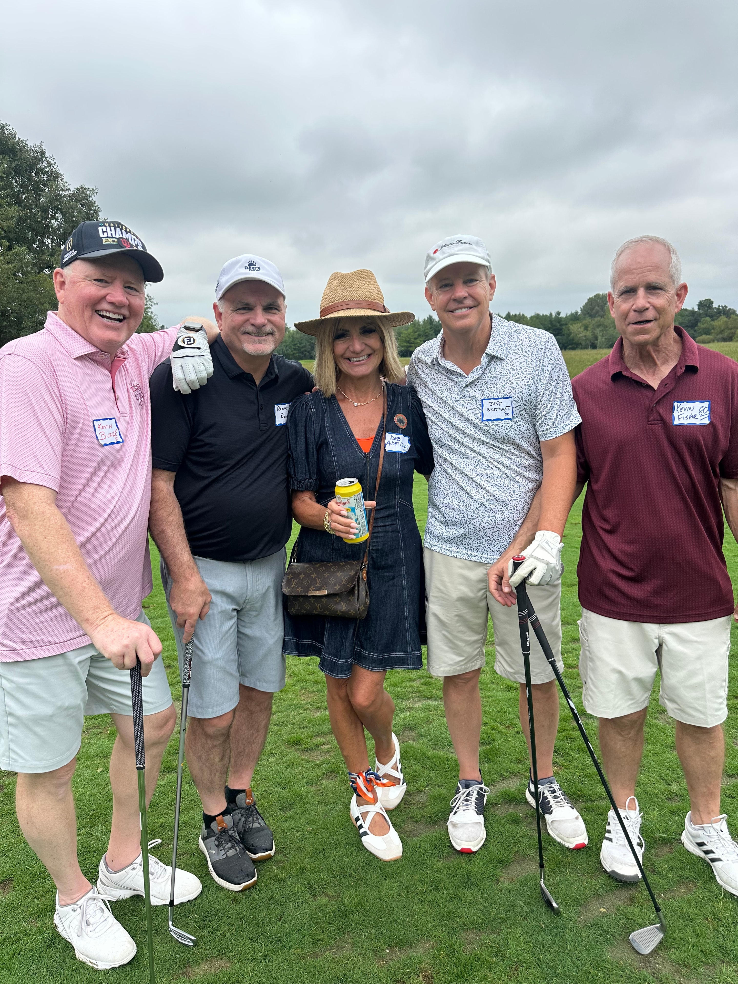 Group of golfers posing on fairway