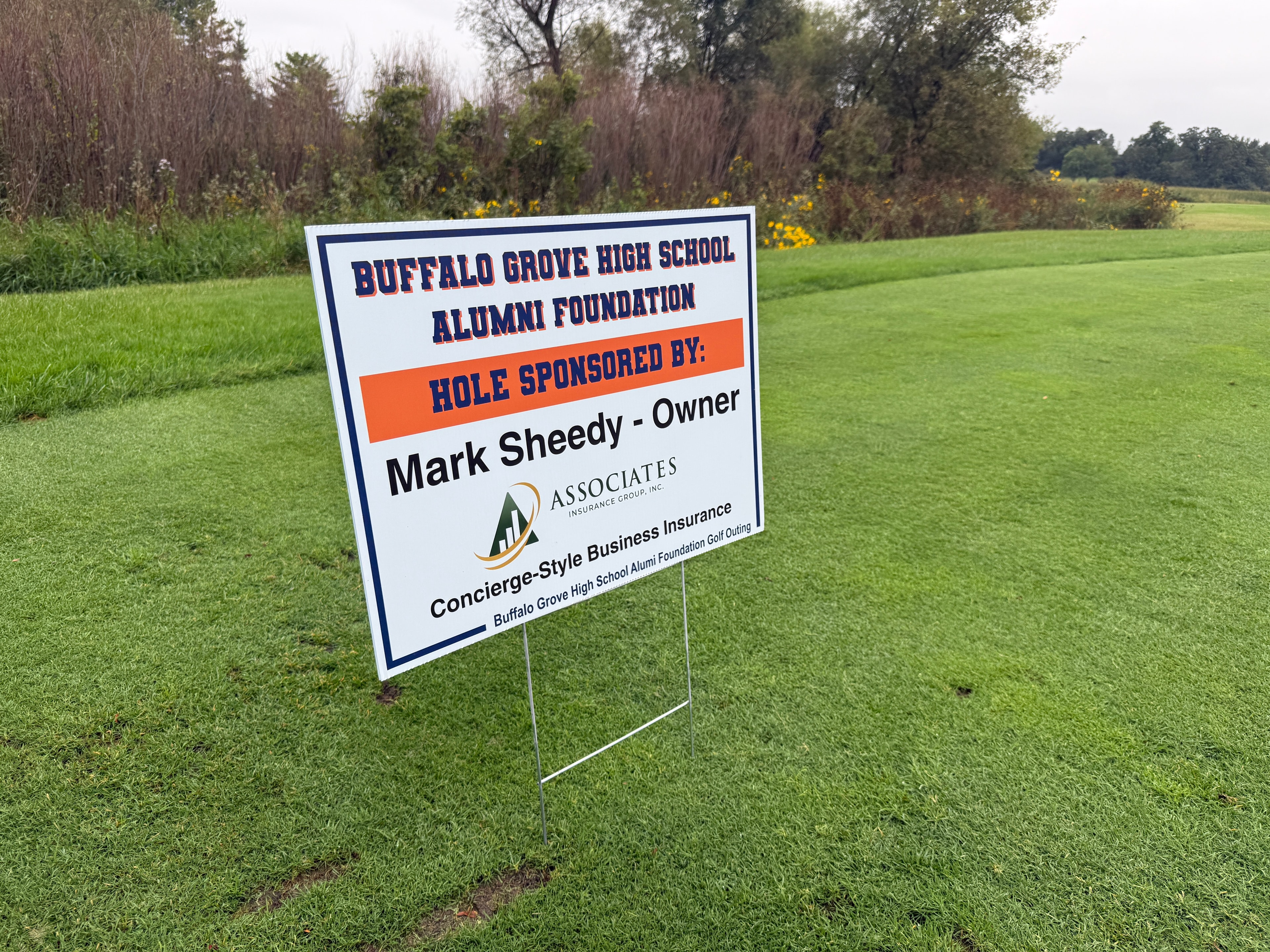 Golf course sponsorship sign in field