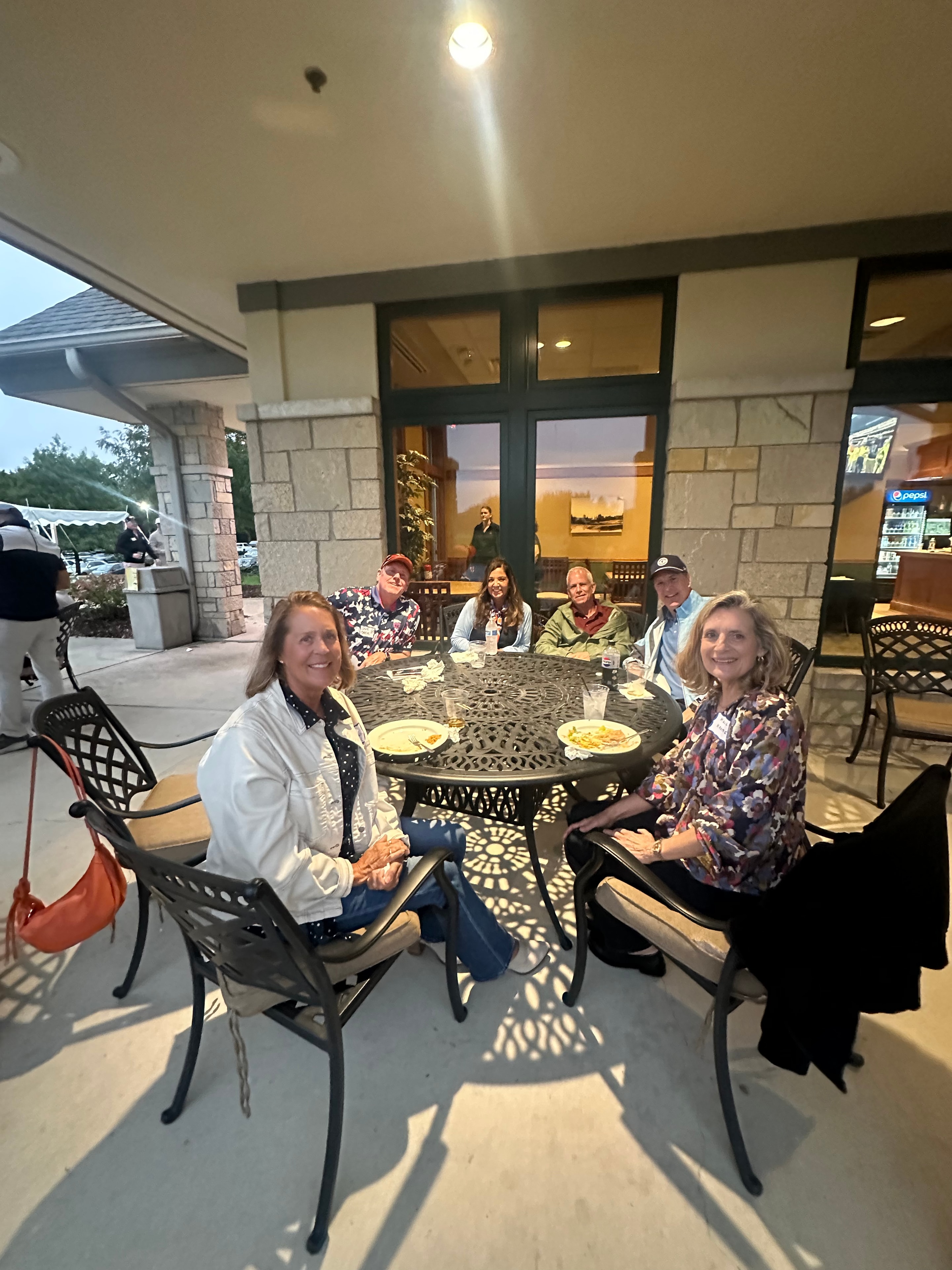 Group dining on outdoor patio evening