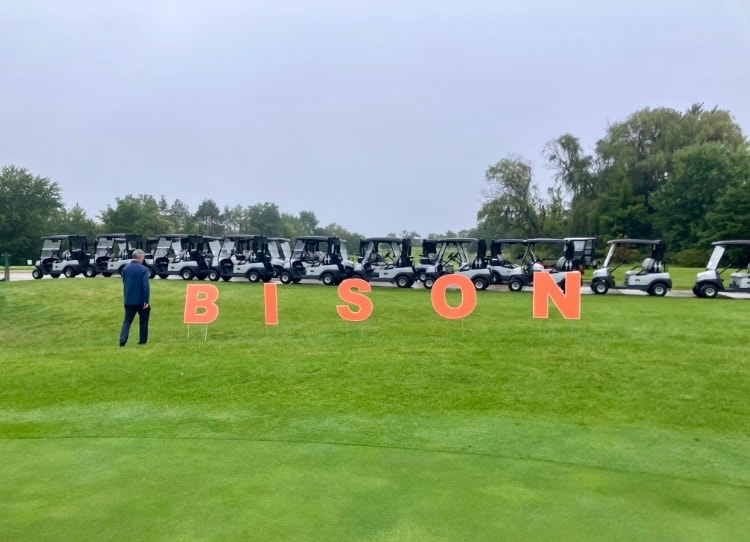 Golf carts lined up at Bison event