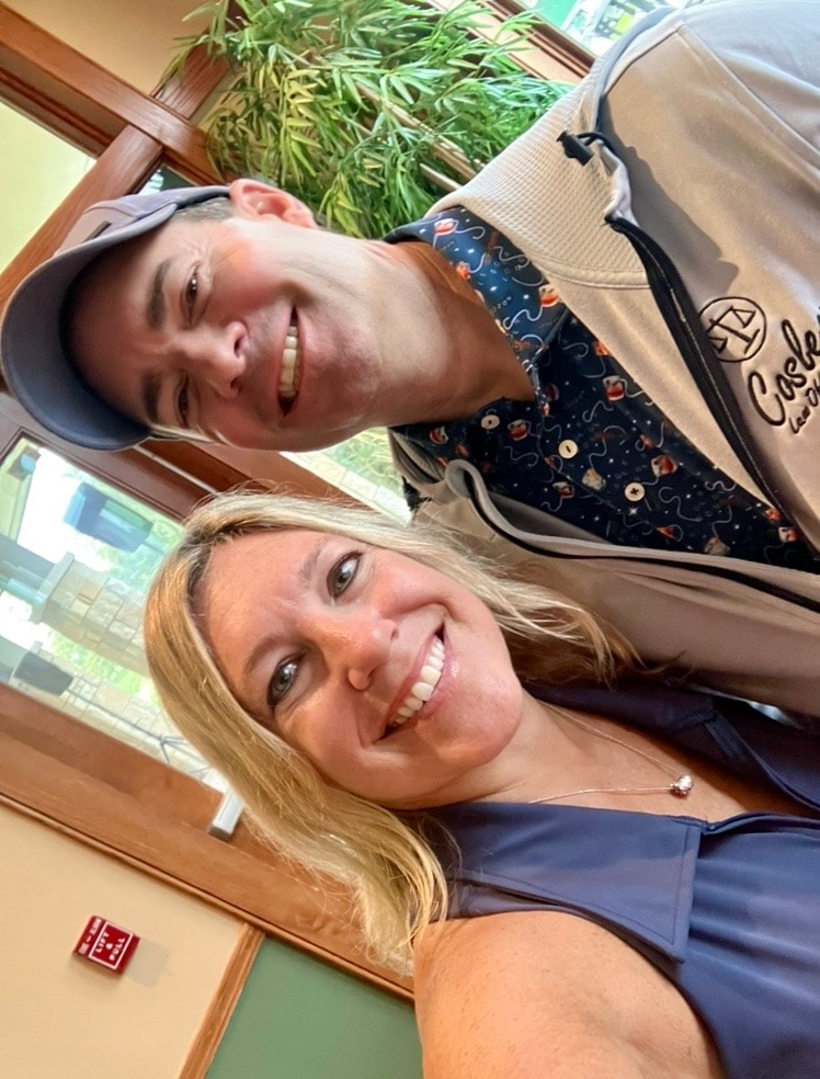 Two people smiling indoors selfie