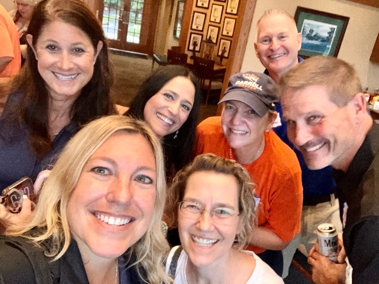 Group of friends smiling indoors together